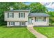 Charming two-story home with white siding, black shutters, and a well-manicured front yard at 1645 Brookdale Ave, Charlotte, NC 28210
