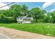 Well-maintained two-story home with lush green lawn and mature trees in a serene neighborhood at 1645 Brookdale Ave, Charlotte, NC 28210