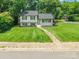Inviting two-story home with a lush front yard and welcoming walkway in a peaceful neighborhood at 1645 Brookdale Ave, Charlotte, NC 28210