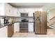 This modern kitchen features stainless steel appliances, granite countertops and decorative backsplash at 1645 Brookdale Ave, Charlotte, NC 28210