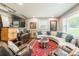 Well-decorated living room with ample seating, artistic accents, and a bright, airy atmosphere at 1645 Brookdale Ave, Charlotte, NC 28210