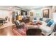 Cozy living room featuring a curved sofa, stylish decor, and a unique accent wall at 1645 Brookdale Ave, Charlotte, NC 28210