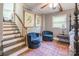 Comfortable main bedroom features a sitting area, staircase and rustic decor at 1645 Brookdale Ave, Charlotte, NC 28210