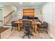 Home office with large desk, built in shelving and staircase at 1645 Brookdale Ave, Charlotte, NC 28210