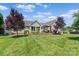 Spacious backyard with a cozy outdoor seating area on the home's deck at 166 Rumple Hill Dr, Statesville, NC 28677