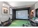 Basement featuring a golf simulator, with dark gray walls, a mini-split, and golf equipment at 166 Rumple Hill Dr, Statesville, NC 28677