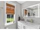 Bathroom vanity featuring an LED mirror, marble countertop, and white cabinets at 166 Rumple Hill Dr, Statesville, NC 28677