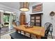 Bright dining room with a large farmhouse table and view to outdoor area at 166 Rumple Hill Dr, Statesville, NC 28677
