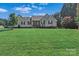 Charming single-story home with a large, well-manicured front lawn and traditional curb appeal at 166 Rumple Hill Dr, Statesville, NC 28677