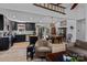 Open-concept kitchen with sleek black cabinetry, stainless steel appliances, and an adjacent dining area at 166 Rumple Hill Dr, Statesville, NC 28677