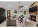 Cozy living room with a stone fireplace, neutral tones, and comfortable seating, perfect for relaxation at 166 Rumple Hill Dr, Statesville, NC 28677