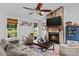 Inviting living room features a stone fireplace, wood accents, and comfortable furnishings for a cozy ambiance at 166 Rumple Hill Dr, Statesville, NC 28677