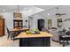 Open floor plan showcases the living and dining area, featuring vaulted ceilings and modern lighting fixtures at 166 Rumple Hill Dr, Statesville, NC 28677
