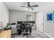 Office space with a ceiling fan, multiple monitors on the desk, and gray walls at 166 Rumple Hill Dr, Statesville, NC 28677
