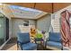 Back patio with outdoor seating, an umbrella, and siding on the back of the house at 166 Rumple Hill Dr, Statesville, NC 28677