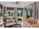 Cozy sunroom with comfortable seating, large windows and garden view at 166 Rumple Hill Dr, Statesville, NC 28677