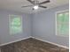 Bedroom featuring ceiling fan, natural light, neutral paint, and wood-look flooring at 1660 Songwood Rd, Concord, NC 28025
