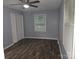 Bedroom featuring ceiling fan, natural light, neutral paint, and wood-look flooring at 1660 Songwood Rd, Concord, NC 28025