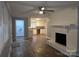 Open floor plan features a decorative fireplace and easy access to the kitchen and laundry room at 1660 Songwood Rd, Concord, NC 28025