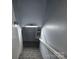 Carpeted stairway descends, lit by overhead fixture, providing access to the home's lower level at 1660 Songwood Rd, Concord, NC 28025