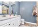 Bathroom with double sink vanity, two mirrors, ample storage, and modern fixtures at 1723 Town Oak Ln, Charlotte, NC 28205