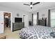Bedroom featuring a large dresser, ceiling fan and a patterned bedspread at 1723 Town Oak Ln, Charlotte, NC 28205