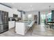 Bright kitchen featuring stainless appliances, center island with seating and wood floors at 1723 Town Oak Ln, Charlotte, NC 28205