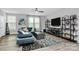 Bright living room with a large window, stylish decor, comfortable seating and modern ceiling fan at 1723 Town Oak Ln, Charlotte, NC 28205