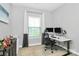 Office space with a modern desk setup, natural light, and comfortable ergonomic chair at 1723 Town Oak Ln, Charlotte, NC 28205