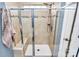 Walk-in shower with glass door, mosaic tile accents, and modern shower head at 1723 Town Oak Ln, Charlotte, NC 28205