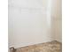 Unfinished basement area with tile floors and wire shelving at 181 Singleton Rd, Mooresville, NC 28117
