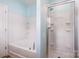 Bathroom featuring tile floor, a soaking tub, and a shower stall with glass doors at 181 Singleton Rd, Mooresville, NC 28117