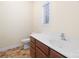 Bathroom featuring tile floor, wood cabinets, white sink and countertop, and a toilet at 181 Singleton Rd, Mooresville, NC 28117