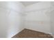 Walk-in closet with carpet and wire shelving at 181 Singleton Rd, Mooresville, NC 28117