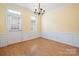 Inviting dining room with hardwood floors, chandelier, and ample natural light at 181 Singleton Rd, Mooresville, NC 28117