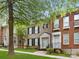 Lovely townhome with brick exterior, black shutters and lush landscaping at 181 Singleton Rd, Mooresville, NC 28117