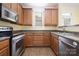 Well-equipped kitchen with stainless steel appliances and wood cabinets at 181 Singleton Rd, Mooresville, NC 28117