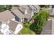 Aerial view of a well-maintained backyard, including a screened porch and stone patio with seating at 188 Lilac Mist Loop, Mooresville, NC 28115