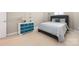 Serene bedroom with a comfortable bed and a charming blue painted dresser at 188 Lilac Mist Loop, Mooresville, NC 28115