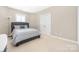 Comfortable bedroom with a bed, carpeted floor, and ample natural light at 188 Lilac Mist Loop, Mooresville, NC 28115
