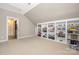 Spacious bonus room with custom built-in shelving for display and storage at 188 Lilac Mist Loop, Mooresville, NC 28115