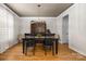 Elegant dining room with modern lighting, hardwood floors, and neutral tones at 188 Lilac Mist Loop, Mooresville, NC 28115