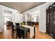 Open dining room with hardwood floors and an elegant chandelier at 188 Lilac Mist Loop, Mooresville, NC 28115