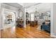 Stylish home office featuring hardwood floors, a large desk, and a comfortable seating area at 188 Lilac Mist Loop, Mooresville, NC 28115