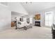 An open concept living room offers high ceilings, neutral tones, and a gas fireplace at 188 Lilac Mist Loop, Mooresville, NC 28115