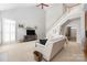 This open-concept living room is bright and offers a staircase and comfortable seating at 188 Lilac Mist Loop, Mooresville, NC 28115
