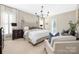 Relaxing main bedroom with a plush bed, soft carpet, and elegant furnishings at 188 Lilac Mist Loop, Mooresville, NC 28115