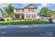 Charming two-story home featuring stone accents and a well-manicured lawn at 19455 Smith Cir, Cornelius, NC 28031