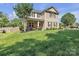 Charming two-story home with stone accents and well-manicured lawn on a sunny day at 19455 Smith Cir, Cornelius, NC 28031