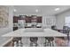 Spacious kitchen with a large island, stainless appliances, and barstool seating at 19455 Smith Cir, Cornelius, NC 28031